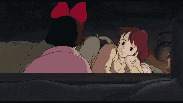 a woman with a red bow on her head sits next to a little girl