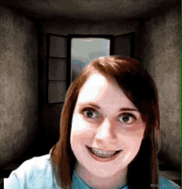a woman is smiling in front of a window and muglife.com is visible in the corner