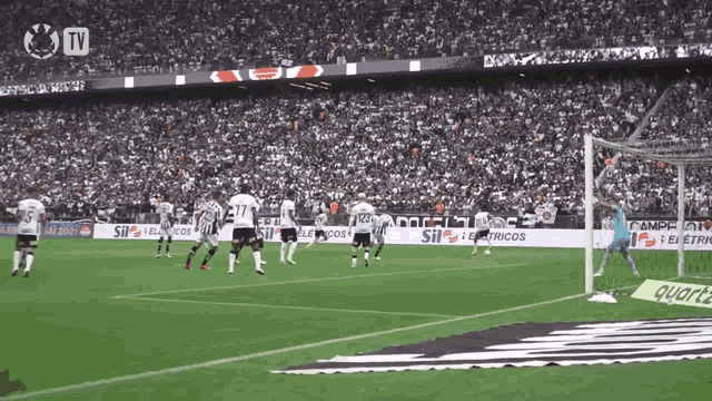a soccer game is being played in a stadium with advertisements for sil