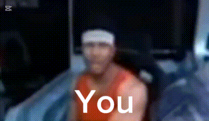 a blurry picture of a man wearing a headband with the word you on it