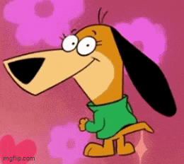 a cartoon dog wearing a green sweater is smiling .