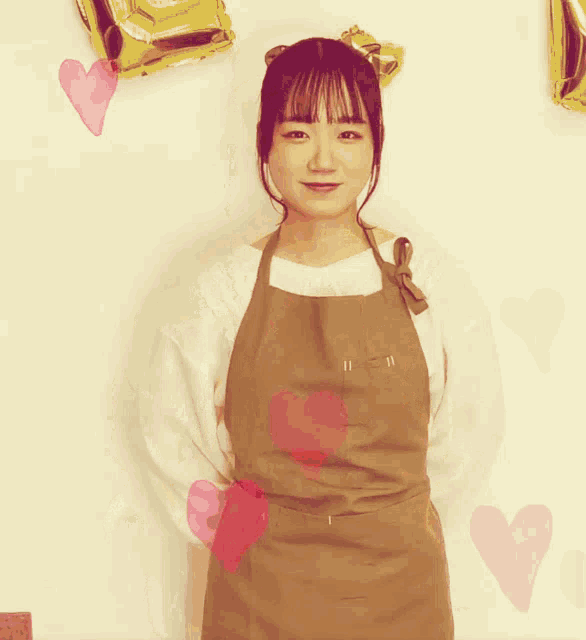a woman wearing an apron has a heart on her chest