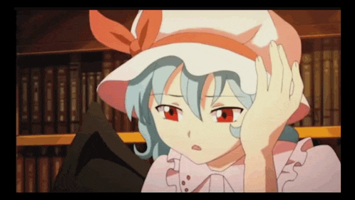 a girl with red eyes and a white hat holds her hand to her face