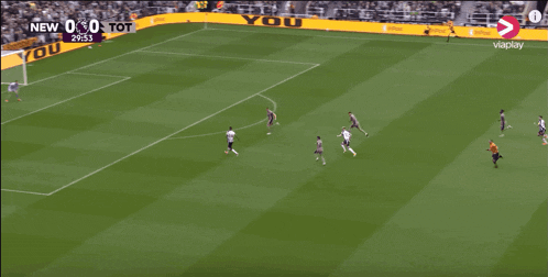 a soccer game is being played on a field sponsored by you win