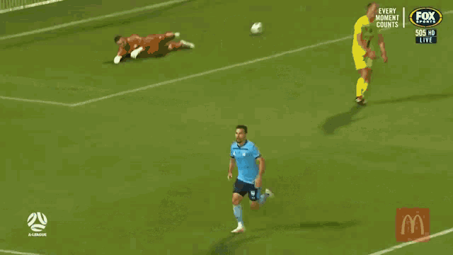 a soccer player in a blue shirt with the number 11 on it