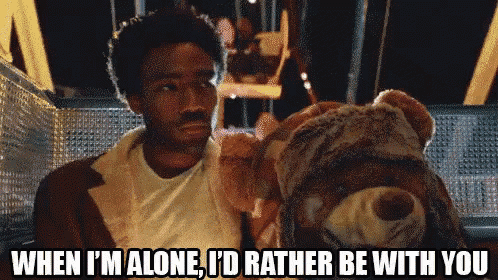 a man holding a teddy bear with the words when i 'm alone i 'd rather be with you