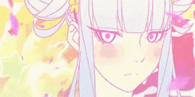 a close up of a girl 's face with a flower in her hair .