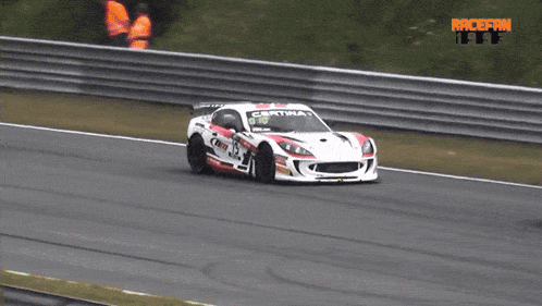 a red and white race car with the number ts on the side
