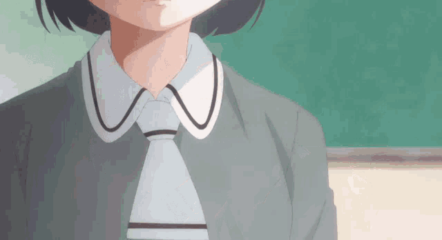 a close up of a person wearing a tie and collar
