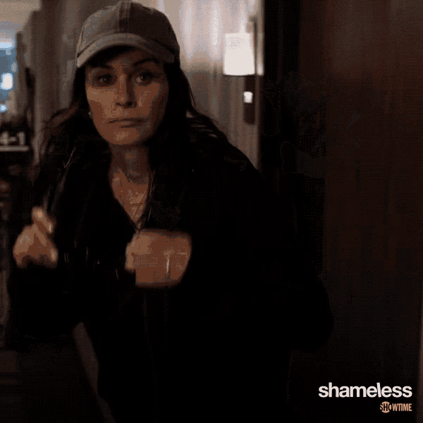 a woman wearing a hat with the word shameless on the bottom right