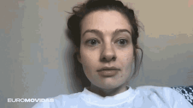 a close up of a woman 's face with euromovidas written on the bottom right
