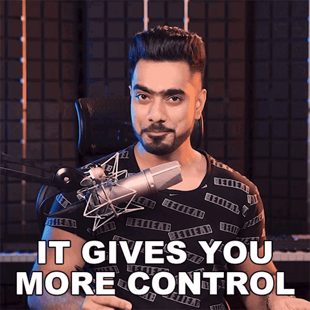 a man in front of a microphone with the words " it gives you more control " above him