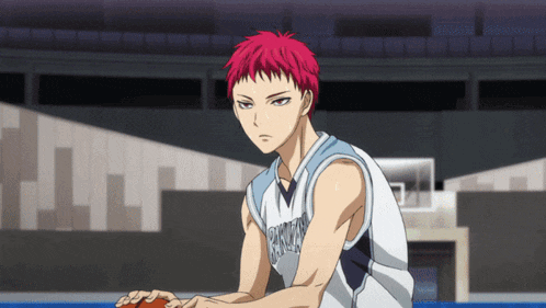 a man with red hair is holding a basketball and his jersey says tokyo