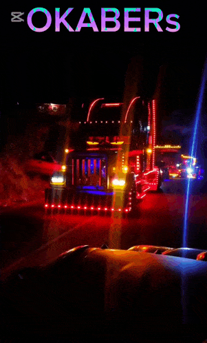 a poster for okabers shows a truck driving down the road at night