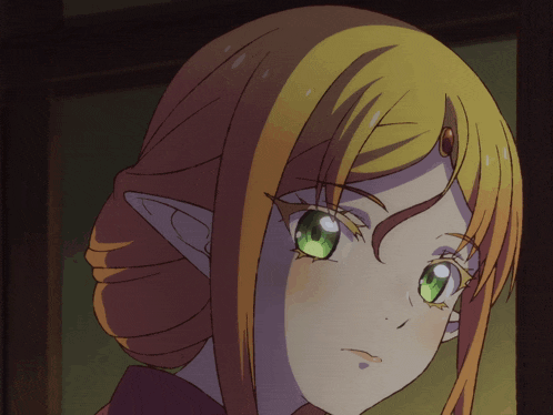 a close up of a girl with green eyes and ears