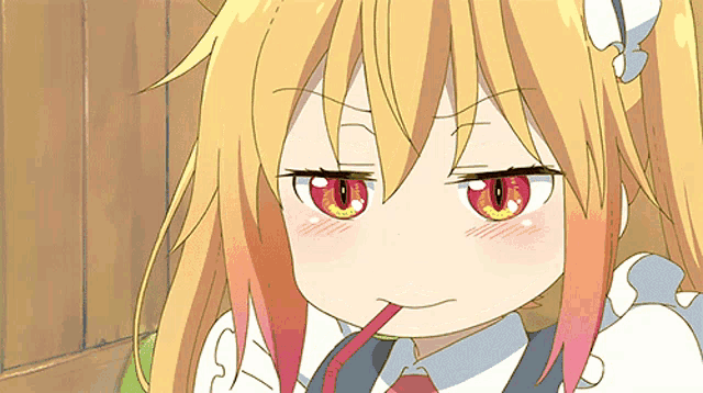 a girl with a straw in her mouth is making a funny face