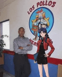 a man and a woman are standing in front of a los pollos restaurant .