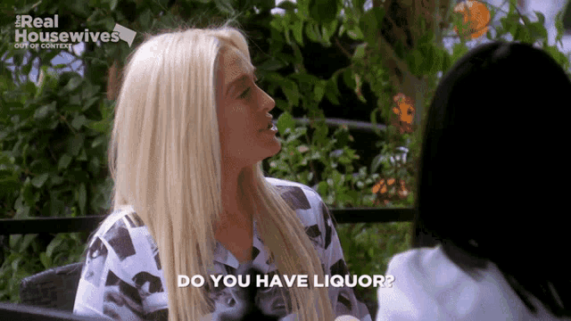 a woman is talking to another woman and the words do you have liquor are displayed