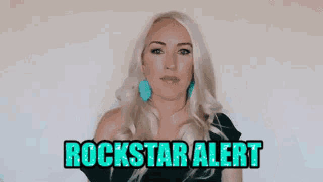 a woman is giving a thumbs up and the words rockstar alert are on the screen