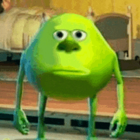 mike wazowski from monsters inc is standing in a room with a sad look on his face .