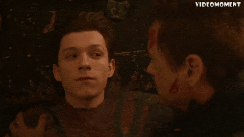 two men are looking at each other and the words videomoment are on the bottom