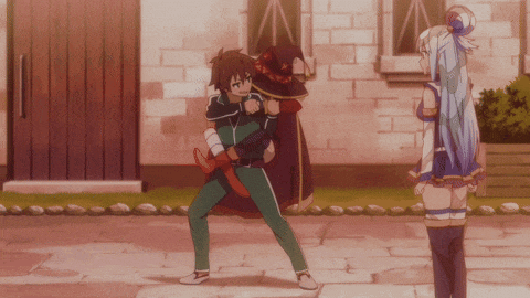 a man is carrying another man in a witch hat