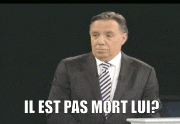 a man in a suit and tie is asking if he is dead