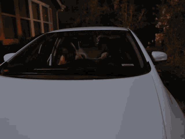 a white car with a license plate that says ' sd ' on it