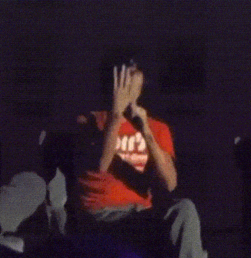 a person wearing a red shirt that says elf