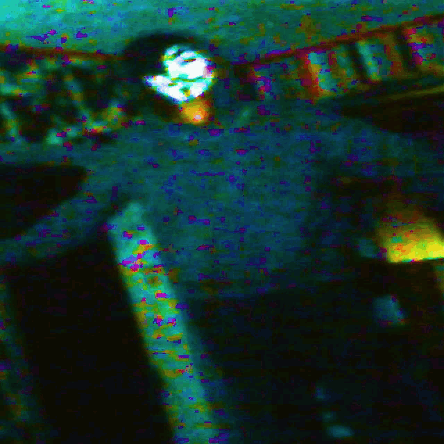 a blurred image of a person with a mask on