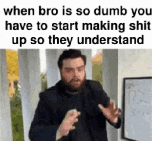 a man with a beard is standing in front of a whiteboard and making a funny face .