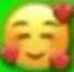 a blurry picture of a yellow smiley face with red flowers on it 's cheeks .