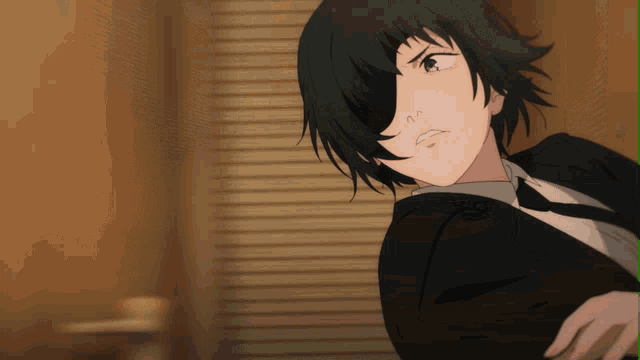 a girl with short black hair and a suit and tie