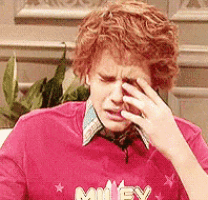 a man with red hair is wearing a red shirt that says miley on it