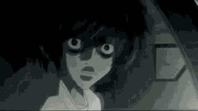 a close up of a person 's face with a surprised look on his face .