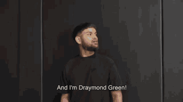 a blurry picture of a person with the words and i 'm draymond green on the bottom