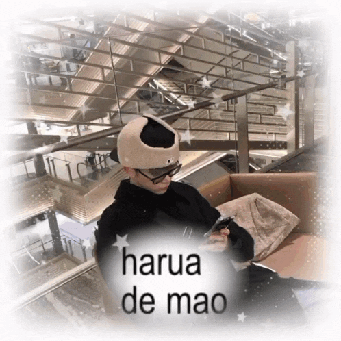 a person sitting on a couch with the words harua de mao written on the bottom