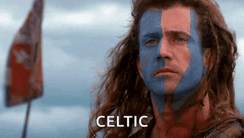 a man with blue and red paint on his face has the word celtic on the bottom