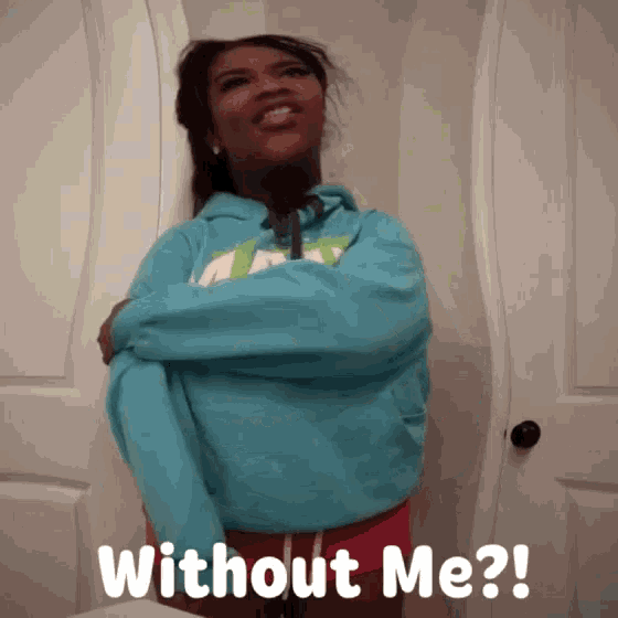 a woman in a blue sweatshirt with the words without me