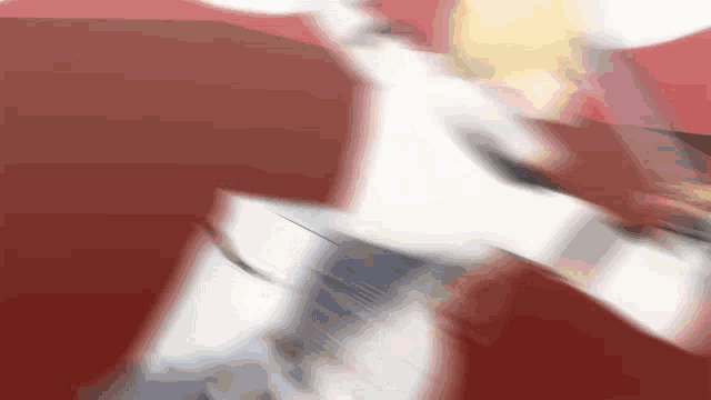 a blurry picture of a person with a red background