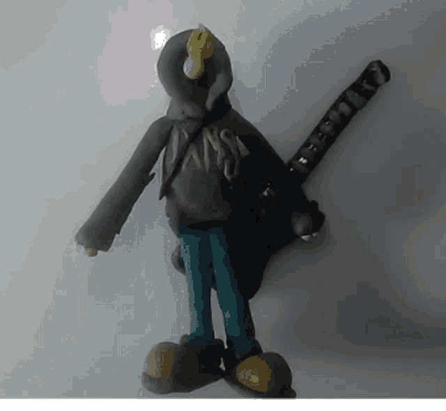 a clay figurine of a person with a hoodie that says ' jans ' on it