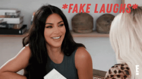 Fake Laugh Not Funny GIF - Fake Laugh Not Funny Kim Kardashian GIFs