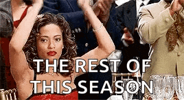 a woman in a red dress is standing in front of a group of people and says `` the rest of this season '' .