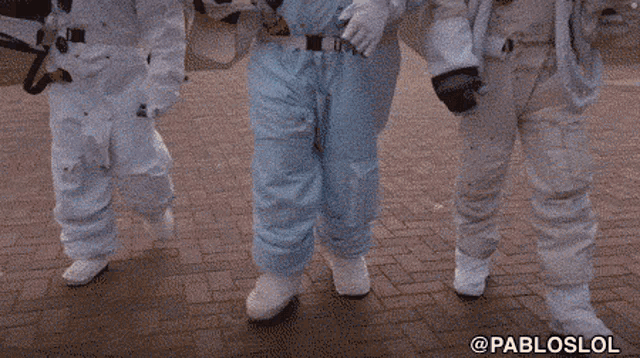 pabloslol is written on the bottom of a picture of astronauts