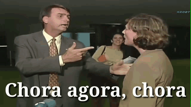 a man in a suit and tie is pointing at a woman with the words chora agora chora written below him