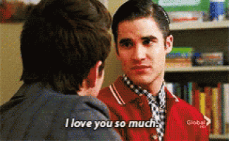 a man in a red jacket says " i love you so much " to another man