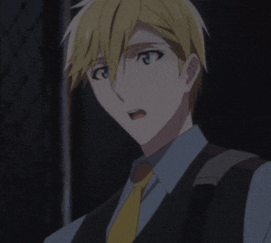 a man with blonde hair and a yellow tie is smiling
