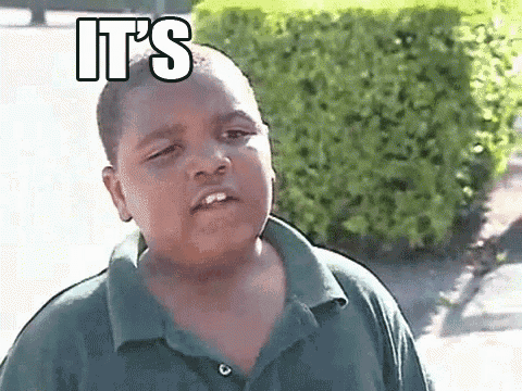 a young boy in a green shirt is making a funny face with the words `` it 's '' written above him .