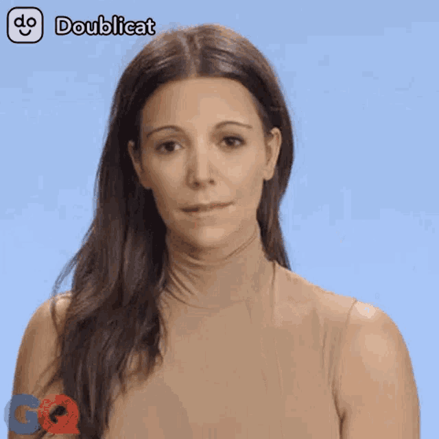 a woman with a ring on her finger is making a middle finger sign