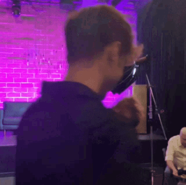 a blurry picture of a person wearing a virtual reality headset .